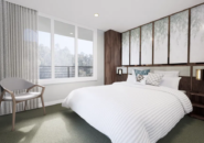 Modern and spacious stateroom with river views aboard a Murray River cruise vessel